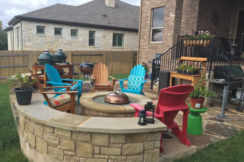 Circular stone fire pit on a flagstone patio