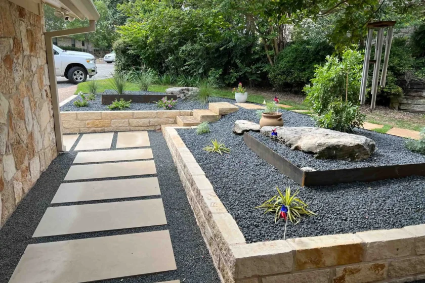 Modern front entry xeriscaping with geometric stone pavers