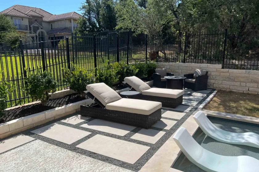 Modern poolside lounge area with geometric concrete pavers